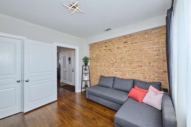 2840 W Glenlake St Unit 3D, Chicago, IL 60659 - living area featuring brick wall and wood finished floors