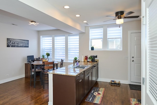 2840 W Glenlake St Unit 3D, Chicago, IL 60659 - kitchen with a sink, dark wood-style floors, ceiling fan, light stone counters, and baseboards