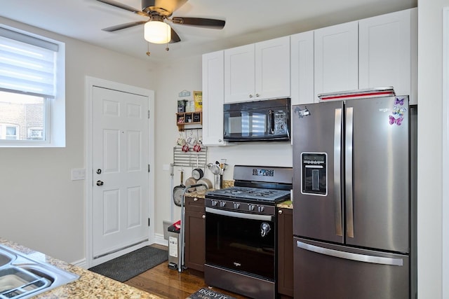 2840 W Glenlake St Unit 3D, Chicago, IL 60659 - kitchen with stainless steel appliances, white cabinets, a ceiling fan, and dark wood finished floors