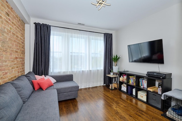 2840 W Glenlake St Unit 3D, Chicago, IL 60659 - living room featuring brick wall and wood finished floors