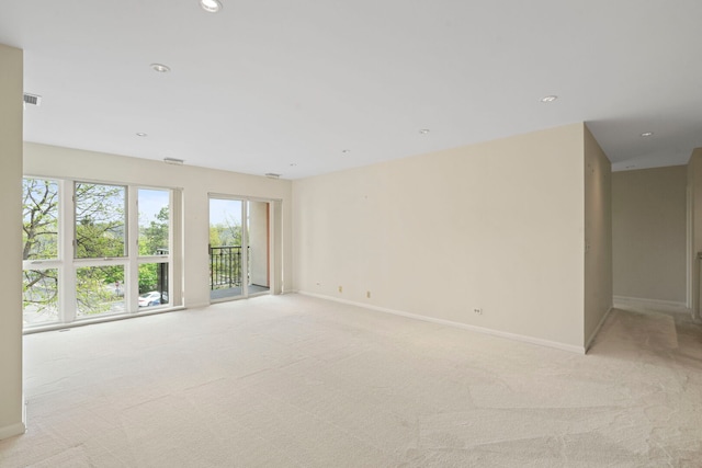 3100 Lexington Ln Unit 203, Glenview, IL 60026 - spare room featuring light colored carpet, baseboards, and recessed lighting