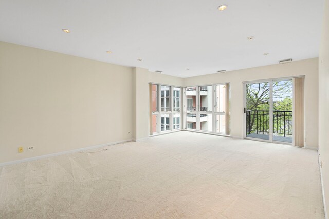 3100 Lexington Ln Unit 203, Glenview, IL 60026 - unfurnished room featuring light colored carpet, baseboards, and recessed lighting
