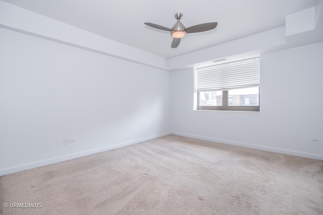 unfurnished room with carpet flooring, baseboards, and ceiling fan