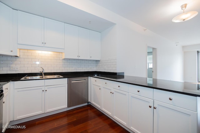kitchen featuring dishwasher, a sink, dark wood-style flooring, decorative backsplash, and white cabinets