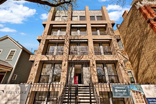 1646 N Orchard St Unit 2, Chicago, IL 60614 - view of front of property featuring a balcony, a fenced front yard, and a gate