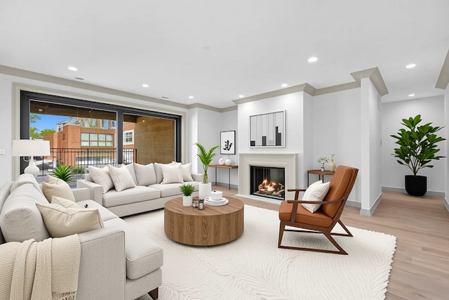 1646 N Orchard St Unit 2, Chicago, IL 60614 - living room with light wood-style floors, baseboards, recessed lighting, a fireplace with flush hearth, and crown molding