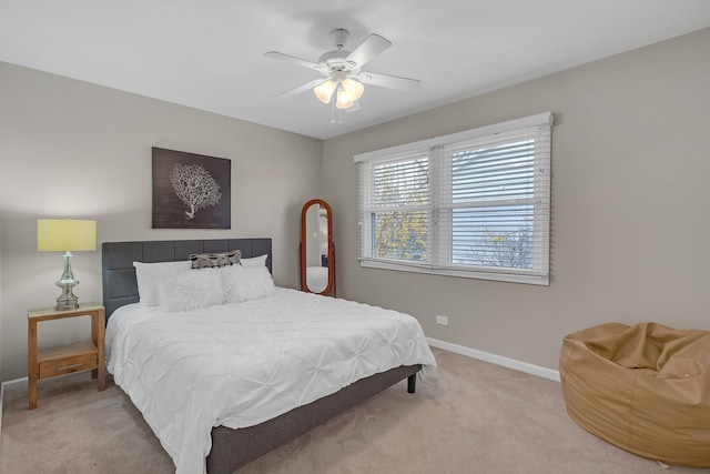 bedroom featuring carpet, baseboards, and a ceiling fan