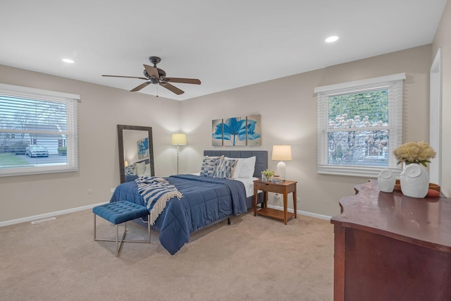bedroom featuring light carpet, baseboards, ceiling fan, and recessed lighting