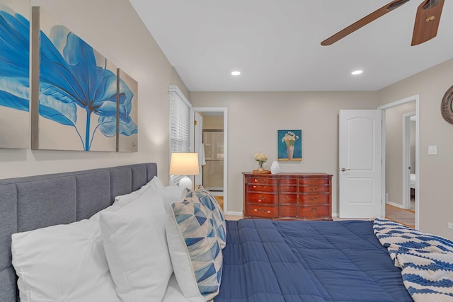 bedroom with baseboards, recessed lighting, a ceiling fan, and ensuite bath