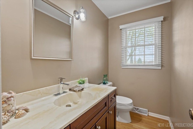 554 Carriage Hill Rd, Naperville, IL 60565 - bathroom with toilet, crown molding, wood finished floors, vanity, and baseboards
