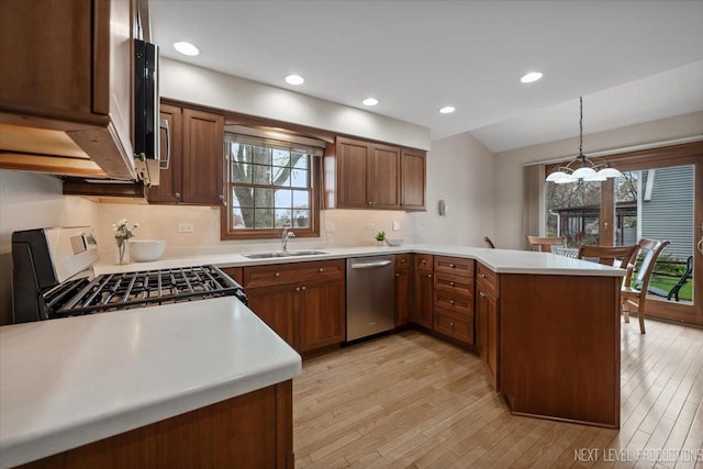 554 Carriage Hill Rd, Naperville, IL 60565 - kitchen featuring a sink, dishwasher, a peninsula, plenty of natural light, and recessed lighting
