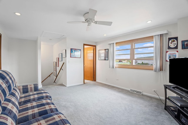 carpeted living area featuring recessed lighting, baseboards, and a ceiling fan