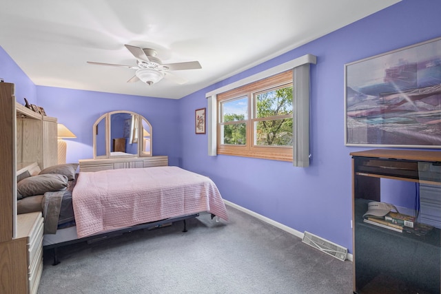 bedroom with carpet floors, baseboards, and ceiling fan