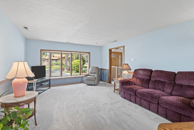 living area featuring carpet flooring
