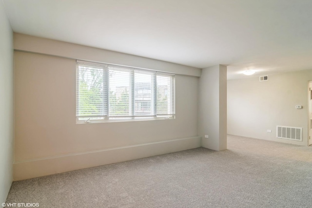 941 N NW Hwy Unit 2B, Park Ridge, IL 60068 - empty room featuring carpet flooring and healthy amount of natural light