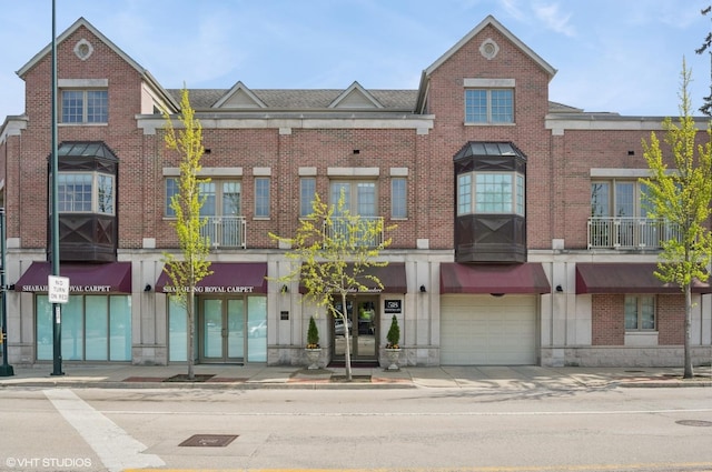 518 Winnetka Ave Unit 203, Winnetka, IL 60093 - view of property with a garage and driveway