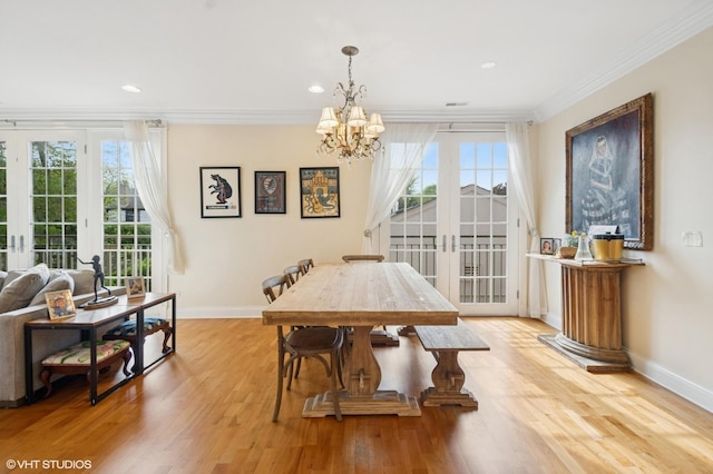 518 Winnetka Ave Unit 203, Winnetka, IL 60093 - dining room with crown molding, baseboards, light wood-type flooring, a chandelier, and recessed lighting