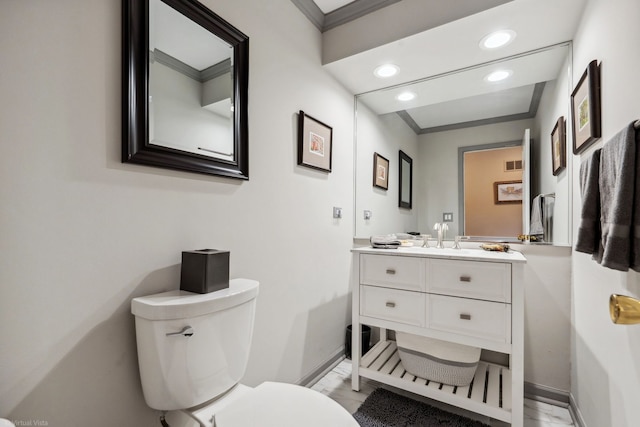 396 Jervey Ln, Bartlett, IL 60103 - half bath featuring baseboards, toilet, recessed lighting, ornamental molding, and vanity
