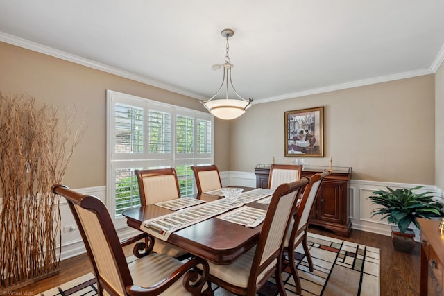 396 Jervey Ln, Bartlett, IL 60103 - dining room featuring crown molding, a wainscoted wall, wood finished floors, and a decorative wall