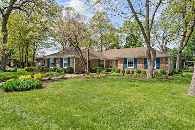 396 Jervey Ln, Bartlett, IL 60103 - ranch-style home featuring brick siding, a front lawn, and a chimney
