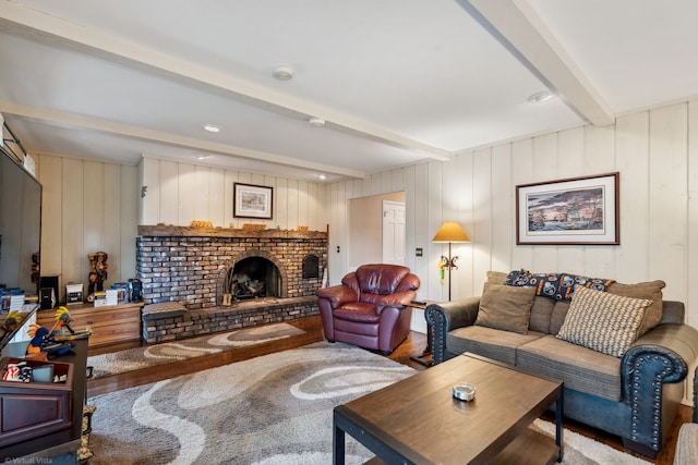 396 Jervey Ln, Bartlett, IL 60103 - living room with beam ceiling, wood finished floors, a brick fireplace, and wood walls