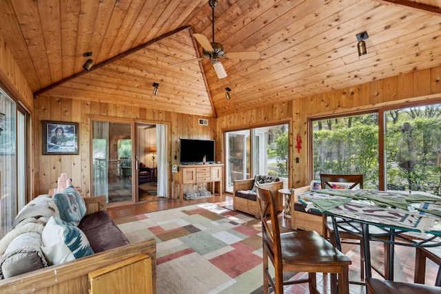396 Jervey Ln, Bartlett, IL 60103 - living area with lofted ceiling, wooden walls, wood finished floors, ceiling fan, and wooden ceiling