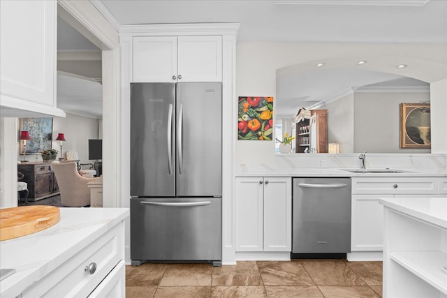 1630 Sheridan Rd Unit 1K, Wilmette, IL 60091 - kitchen with stainless steel appliances, ornamental molding, white cabinetry, and a sink