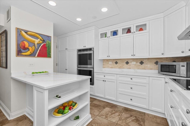 1630 Sheridan Rd Unit 1K, Wilmette, IL 60091 - kitchen featuring appliances with stainless steel finishes, open shelves, white cabinetry, light stone counters, and recessed lighting