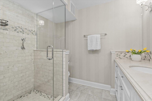 1630 Sheridan Rd Unit 1K, Wilmette, IL 60091 - bathroom with a stall shower, baseboards, and vanity
