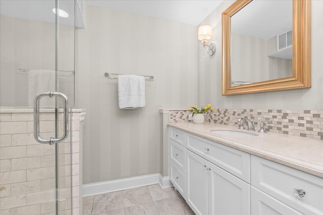1630 Sheridan Rd Unit 1K, Wilmette, IL 60091 - full bath featuring vanity, a stall shower, decorative backsplash, and baseboards