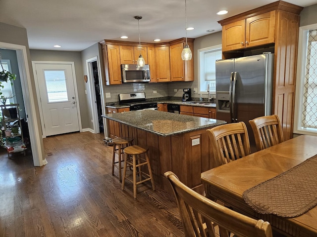 6710 W Harts Rd, Niles, IL 60714 - kitchen featuring stainless steel appliances, a sink, plenty of natural light, dark wood-type flooring, and recessed lighting
