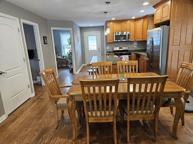 6710 W Harts Rd, Niles, IL 60714 - dining area featuring dark wood finished floors, baseboards, and recessed lighting
