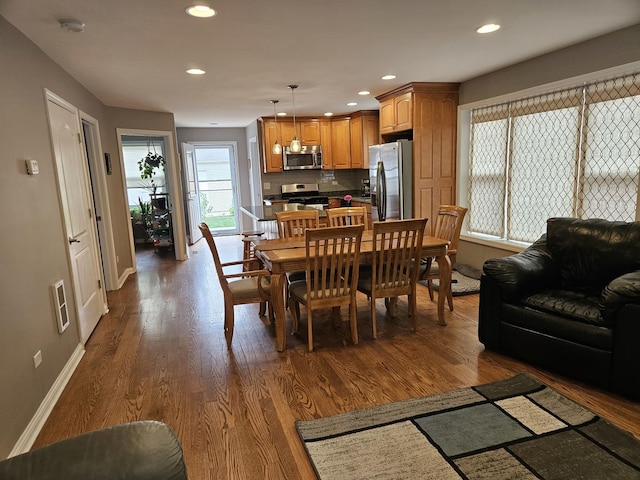 6710 W Harts Rd, Niles, IL 60714 - dining space with baseboards, recessed lighting, and dark wood finished floors