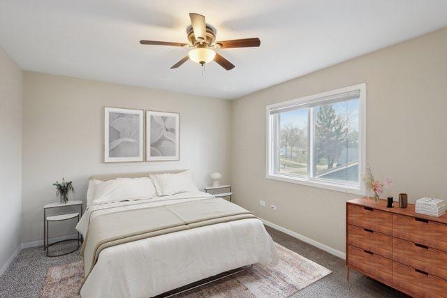 bedroom featuring baseboards, carpet floors, and a ceiling fan