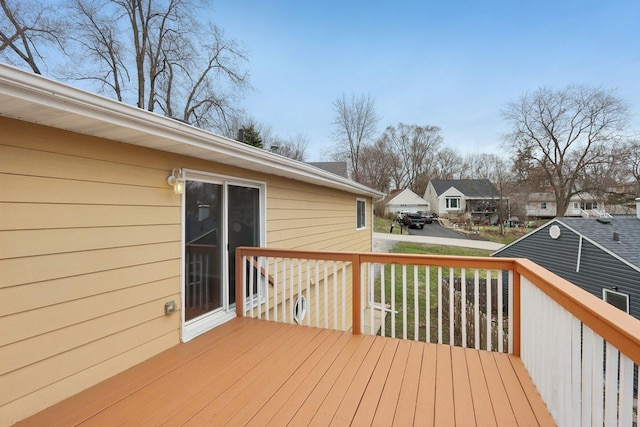 wooden terrace with a residential view