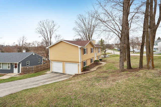 view of property exterior with asphalt driveway, an attached garage, and a chimney