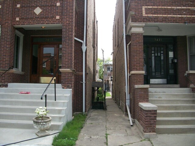 7421 S Eberhart Ave, Chicago, IL 60619 - entrance to property featuring brick siding