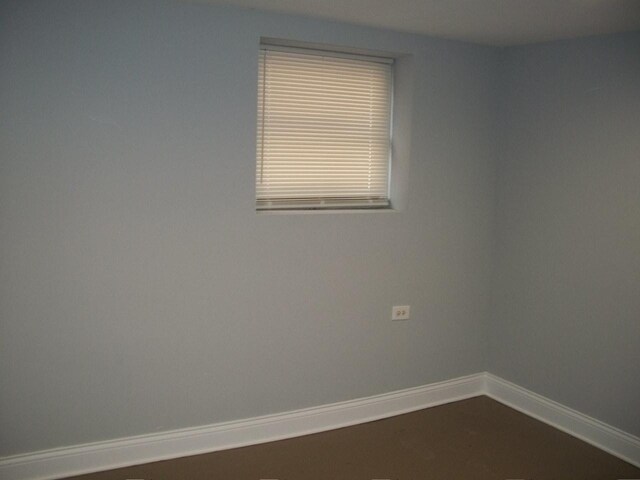 7421 S Eberhart Ave, Chicago, IL 60619 - spare room with baseboards