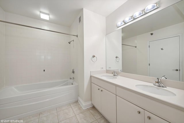 33 W Ontario St Unit 25H, Chicago, IL 60654 - full bath with tile patterned floors, shower / tub combination, double vanity, and baseboards