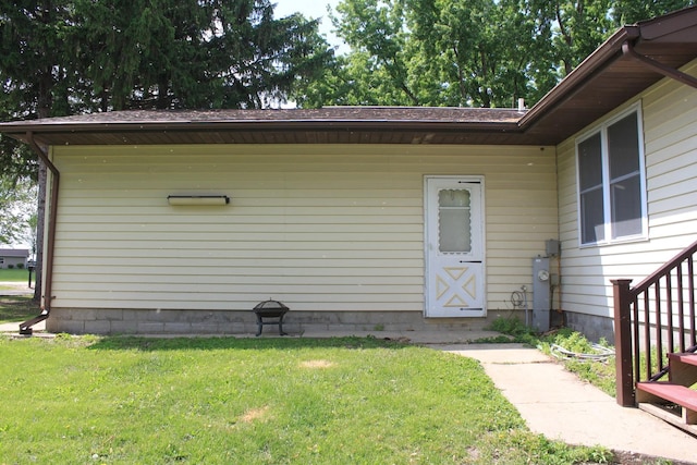 entrance to property with a yard
