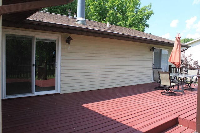 wooden terrace with outdoor dining space