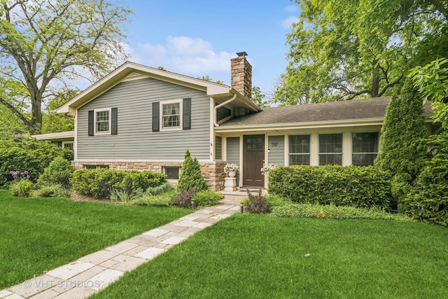 90 Golfview Rd, Lake Zurich, IL 60047 - split level home featuring a chimney, a front lawn, and stone siding