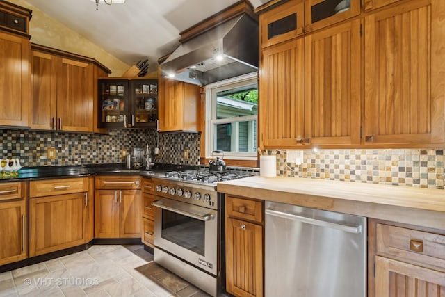 90 Golfview Rd, Lake Zurich, IL 60047 - kitchen with stainless steel appliances, vaulted ceiling, tasteful backsplash, range hood, and brown cabinetry