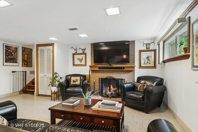 90 Golfview Rd, Lake Zurich, IL 60047 - living room featuring baseboards, speckled floor, a brick fireplace, and stairway