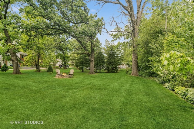 90 Golfview Rd, Lake Zurich, IL 60047 - view of grassy yard featuring an outdoor fire pit