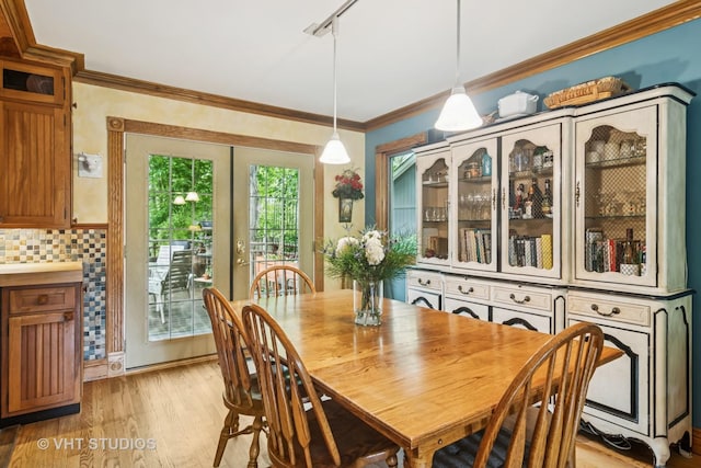 90 Golfview Rd, Lake Zurich, IL 60047 - dining room with light wood-style floors, french doors, track lighting, and crown molding