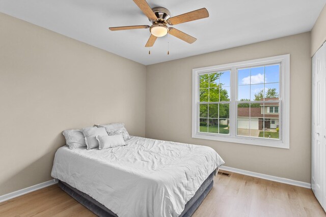10S241 Wallace Dr, Downers Grove, IL 60516 - bedroom with baseboards, light wood finished floors, and a ceiling fan