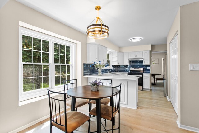 10S241 Wallace Dr, Downers Grove, IL 60516 - dining space with a chandelier, baseboards, and light wood-style flooring