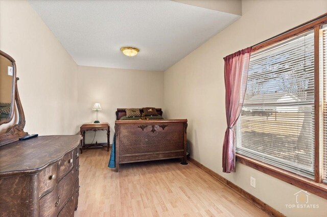 206 Walnut St, Cherry Valley, IL 61016 - bedroom with light wood-style flooring and baseboards