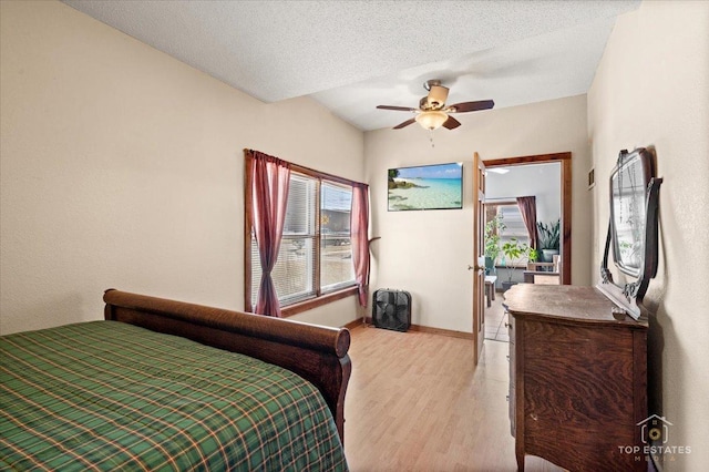 206 Walnut St, Cherry Valley, IL 61016 - bedroom with light wood finished floors, multiple windows, baseboards, and a ceiling fan